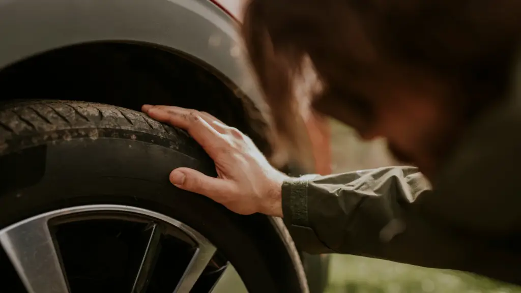 How old are my tires? Driver checking the DOT date code on a tire sidewall